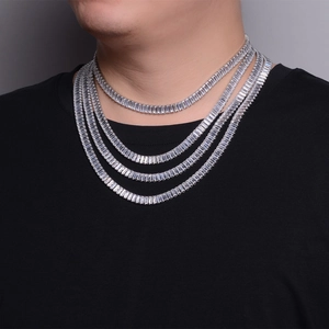 Detail of silver layered tennis necklaces with square sparkling cubic zirconia stones