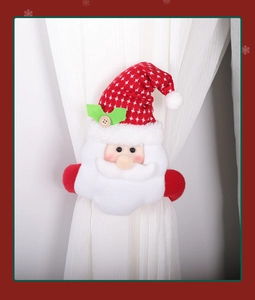 Close-up of Santa Claus plush curtain tieback fastener with festive red holiday details