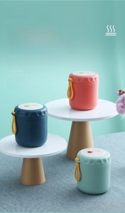 Three assorted colors of portable 304 stainless steel breakfast cups on display stands