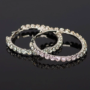 Silver-tone oversized hoop earrings with shimmering cubic zirconia stones and secure clasp