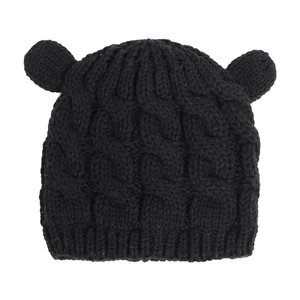 Close-up of black cable knit baby hat with cute animal ears and thick texture