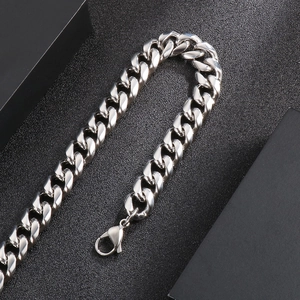 Close-up of a bold silver stainless steel Cuban link chain with a secure lobster clasp
