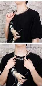 Macro shot of 12mm silver stainless steel Cuban link chain for men street fashion