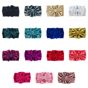Detailed grid view showing 15 colorful velvet oversized bow headbands for babies