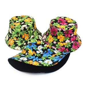 Three cotton floral bucket hats with colorful sunflower prints and black lining