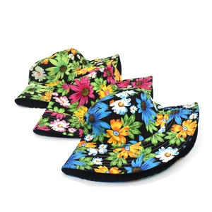 Detail showing high-quality stitching and vibrant floral prints on cotton bucket hats