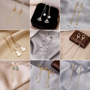 Elegant collection of gold and silver tassel earrings with pearls and butterfly designs