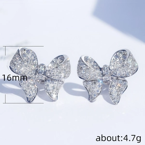 Bowknot silver earrings with pavé cubic zirconia measuring 16mm and weighing 4.7g