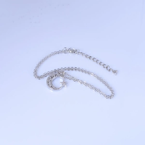 Silver star and moon pendant necklace with zircon crystals on a fine 18K gold chain