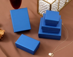 Luxurious peacock blue jewelry gift boxes in various sizes with pearl luster finish