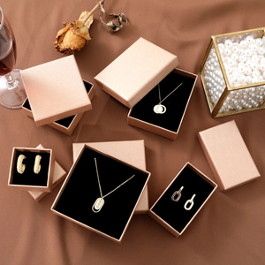 Champagne gold jewelry gift box set for necklaces and earrings on elegant silk background
