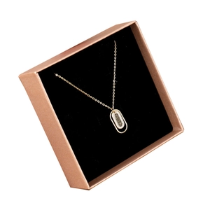 Champagne gold necklace with Roman numeral ring pendant in a premium velvet gift box