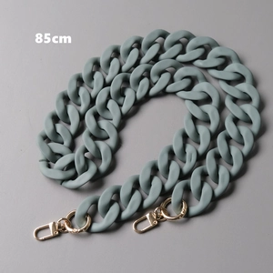 Macro detail of 85cm olive green matte resin bag chain with gold lobster clasps