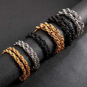 Detailed view of woven metal chains in gold, silver, and black finish with rope texture