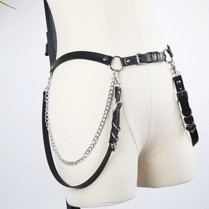 Detail of punk gothic leather body harness with metal chains and adjustable buckles