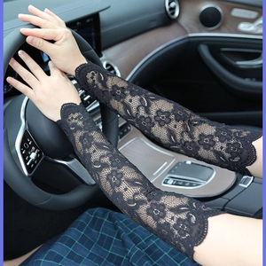 Close-up of black lace cooling arm sleeves with floral texture for sun protection
