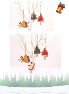 Detail showing colorful painted angel ornaments hanging with twine on white branches