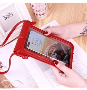 Close-up of red PU leather crossbody phone bag with transparent touchscreen window