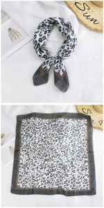 Detail of leopard print cotton linen square scarf with dark brown contrast borders