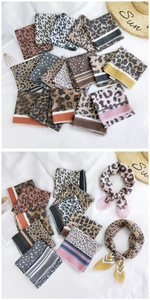 Macro view of cotton linen scarves featuring leopard patterns in multiple colors