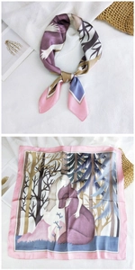 Detailed view of silk square scarf featuring forest illustration and satin finish
