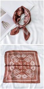 Detail view of burgundy silk square scarf with classic paisley pattern and polka dot border
