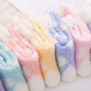 Soft coral fleece mid-calf socks for women in pastel pink, yellow, blue, and purple hues