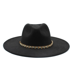 Close-up of black wool fedora featuring an ethnic handcrafted beaded hatband