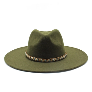 Olive green wide brim fedora hat with bohemian beaded band on a white background