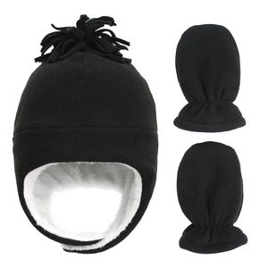 Detail of children's winter fleece hat with earflaps and matching mittens set in black