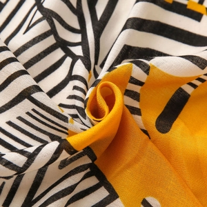 Detailed macro view of the breathable cotton linen texture and bold geometric pattern