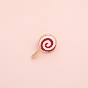 Macro detail of a colorful lollipop enamel brooch pin with red and white spiral design