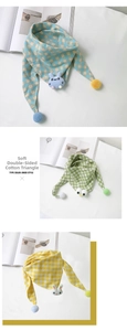 Detail of baby cotton plaid triangle scarf with cute plush rabbit and pompom decor