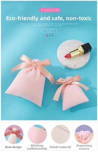 Close-up of pink velvet jewelry pouch with satin ribbon drawstring and reinforced stitching