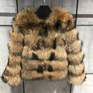Detail of horizontal faux fox fur stitching with rich brown and black textures