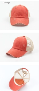 Detail of orange distressed baseball cap with breathable mesh and ponytail cross band hole
