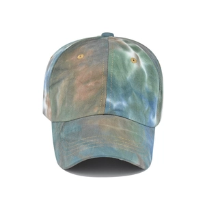 Detailed close-up of a tie-dye cotton ponytail baseball cap with reinforced stitched brim