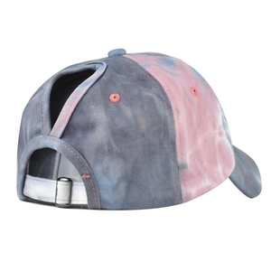 Detail of tie-dye ponytail baseball cap featuring unique opening and metal buckle