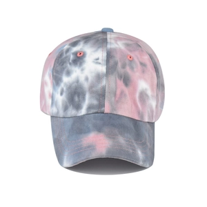 Close-up of tie-dye cotton fabric texture and reinforced stitching on visor cap