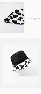 Detail shot of breathable black mesh crown and cow print brim on summer bucket hat