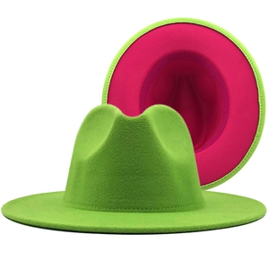 Two-tone wool fedora hat with grass green exterior and vibrant magenta interior lining