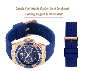 Macro detail of blue rubber strap and gold diamond bezel on Miss Fox quartz watch