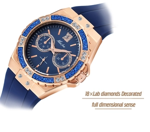 Macro detail of rose gold watch bezel with blue glitter and laboratory diamonds