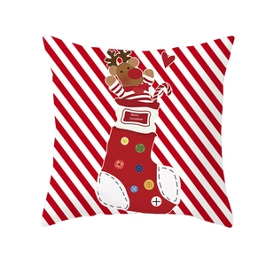 Detail of red and white Christmas pillowcase with elk and festive stocking patterns