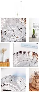 Close-up of telescopic stainless steel steamer tray with folding petals and vent holes