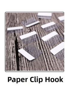 Adhesive plastic display tabs for jewelry card hooks on a dark wood background