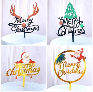 Detailed views of four printed acrylic Christmas cake toppers with Santa and deer designs