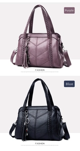 Close-up of purple and blue soft leather handbags featuring tassel and V-stitch texture