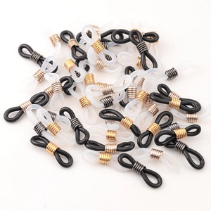 Macro detail of silicone and metal eyeglass chain connectors in black and transparent