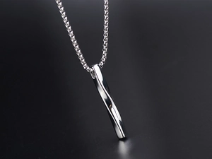 Macro shot of silver twisted bar pendant necklace in stainless steel on dark background